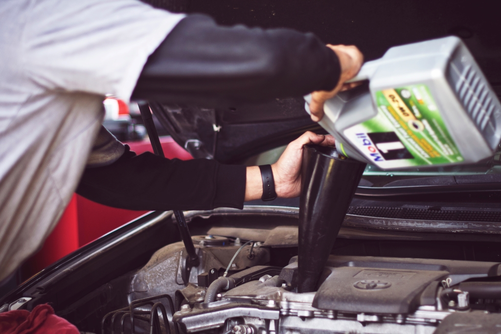 By moving closer to work, you will have more car maintenance such as oil changes, pictured here.