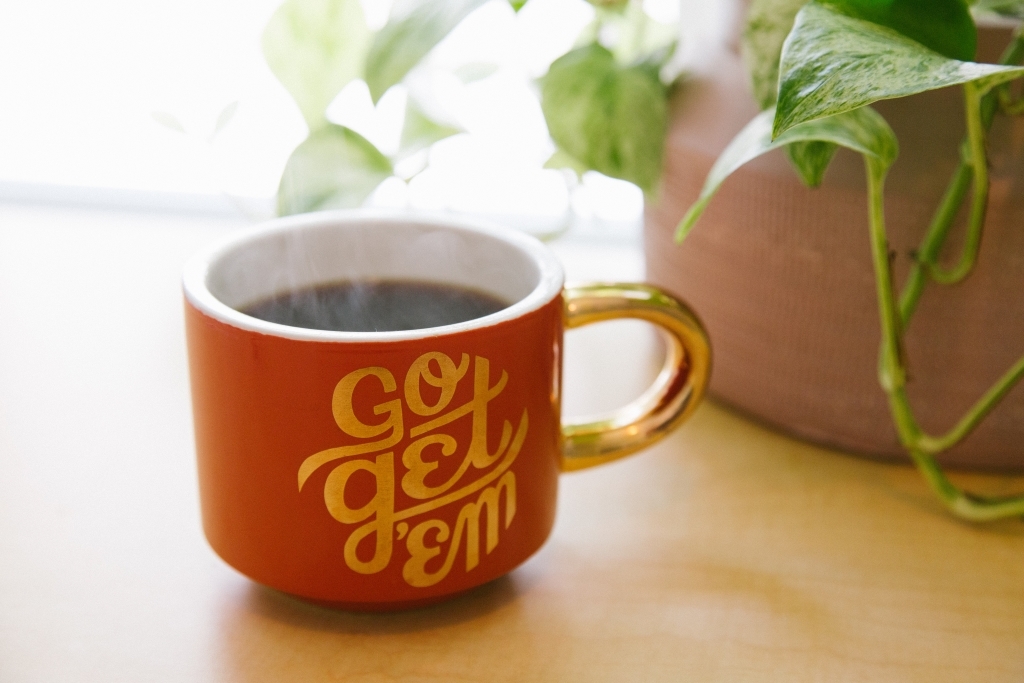 Coffee Cup with "Go get 'em" on the side